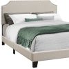 Beige Standard Bed Upholstered With Nailhead Trim And With Headboard